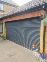 After picture of double garage sprayed onsite in Norfolk. Garage sprayed using our unique plastic paint spray system in RAL 7016.