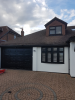 After picture of onsite uPVC coating of windows, doors and garage in Upminster, Essex. Coated in specialist uPVC paint RAL 9011.