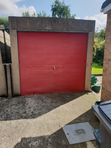 Before picture of metal garage door onsite in Southend, Essex.