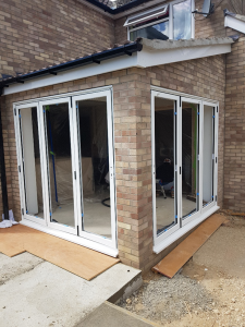 Before picture of uPVC coated in bi-fold onsite in Colchester, Essex.