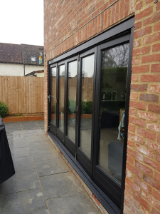 Bi-fold doors coated onsite in Stansted in special uPVC paint 9011.