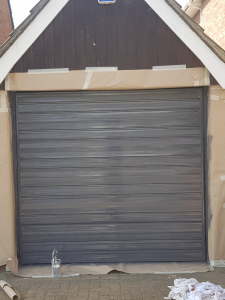 Garage door coated onsite in Colchester, Essex using a unique coating system.