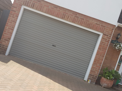 Garage door coated onsite in Colchester, Essex, using specialist uPVC paint in a Farrow and Ball colour.