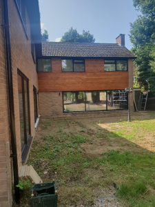 UPVC coating of all windows in our unique uPVC paint RAL 9005 matt, onsite in Colchester, Essex.