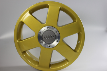 Audi wheel powder coated in gold sparkle.