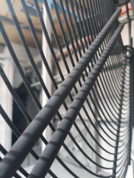 Before baking picture of fan guard. Guard powder coated in black at our Colchester factory.
