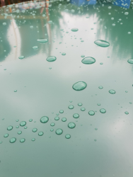 Powder coated silencer unit showing water droplets. Colour BS 14 C 39.