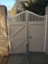 Wooden gates coated onsite in Colchester in RAL 1019.